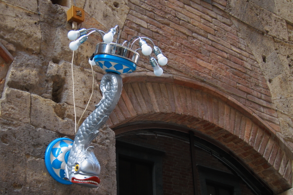 A decorative street lamp representing the Contrada Onda in Siena in Tuscany  taly