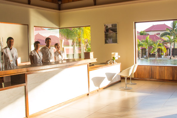 Benoit, Rooms Manager, with his staff in reception at the Tamassa hotel, Bel Ombre on Mauritius