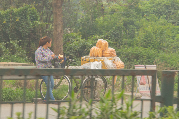 Bread seller by the roadside in Vietnam