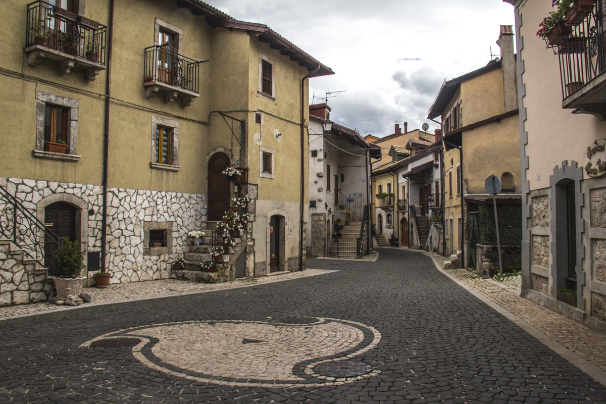 Design made from white river stones in a street in Pescasseroli, Abruzzo, italy   9909