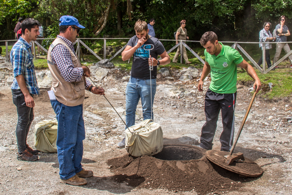 Digging up a Cozido das Furnas in the valley of Furnas on São Miguel Island in the Azores