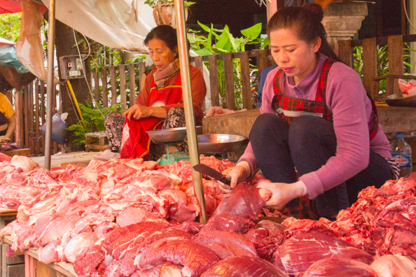 Fresh meat stalls at the morning market in Luang Prabang, Laos