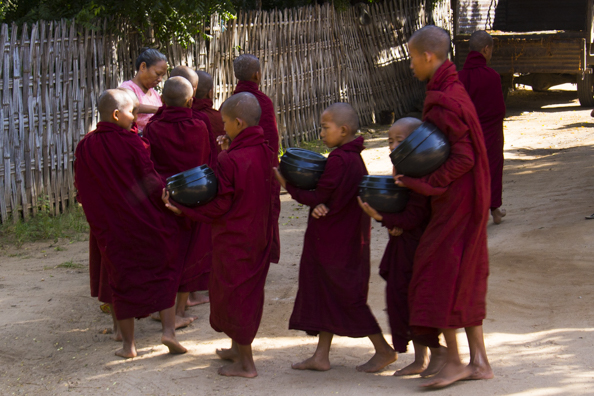 Monks collecting food in Old Bagan Myanmar