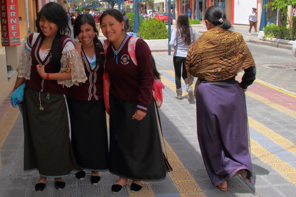 Schoolgirls in traditional school uniforms in Otavalo Ecuador