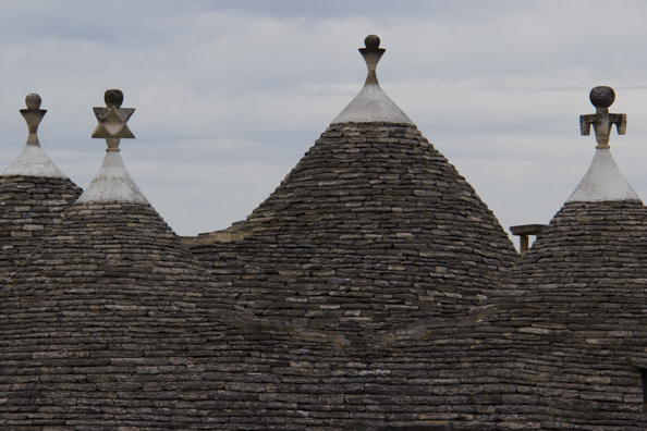 Pinnacles on the roofs of the trulli of Alberobello  in Puglia, Italy