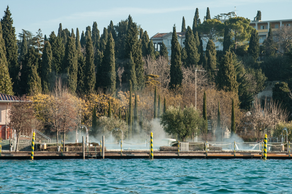 Steam rising from the Aquaria spa park in Sirmione on Lake Garda in Italy