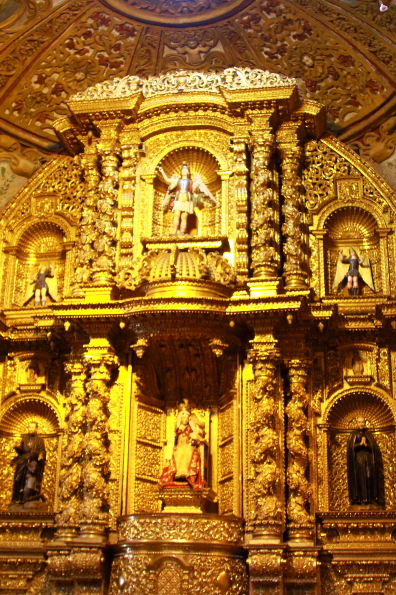 The ornate interior of the Iglesia La Compañía de Jesús in Quito Ecuador