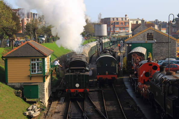 Steam train departing from Swanage station in Dorset